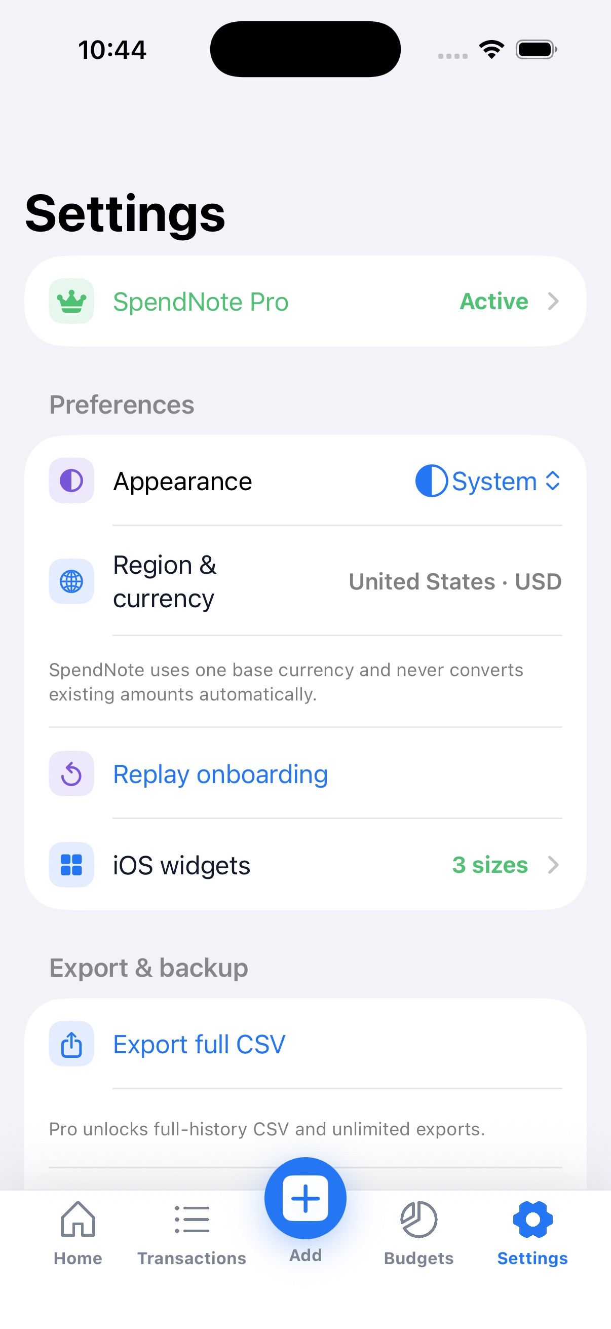 Settings screen showing SpendNote Pro status, appearance, region and currency, widgets, and data export